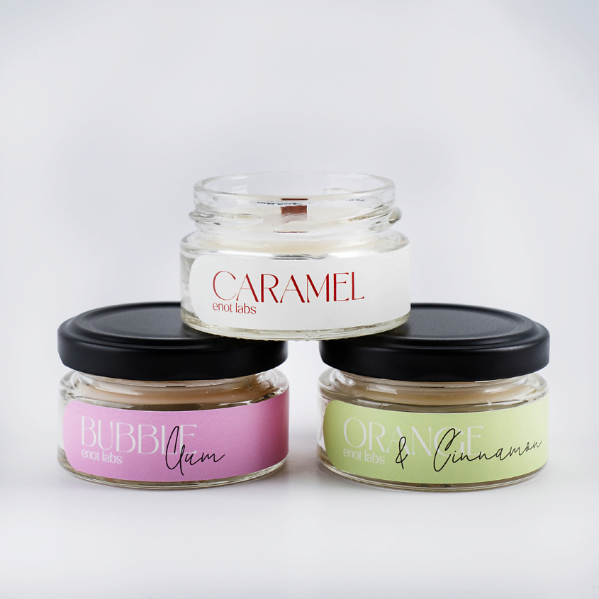 Изображение товара ENOT LABS Набор ароматических свечей для дома, Набор ароматических свечей "Карамель, Tabacco&Vanilla, Цитрусовый десерт с ванильным кремом" включает в себя 3 мини-свечи с деревянным фитилем